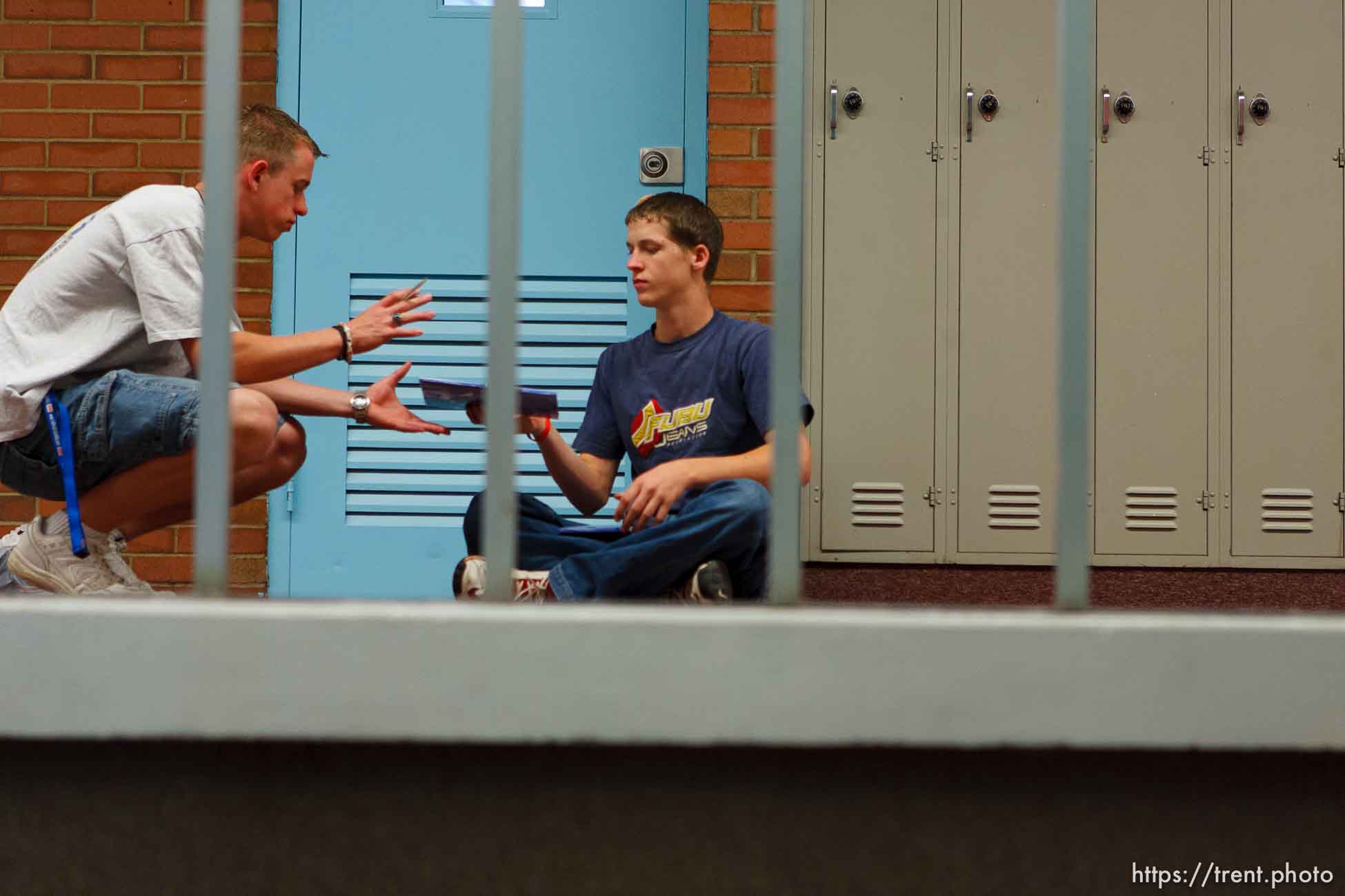 Signing yearbooks at East Carbon High School, David Stewart (left) and Travis Hepworth. The small town of Sunnyside's East Carbon High School is being closed. The students will be transfered to Price's Carbon High School, a 25-minute bus ride away.