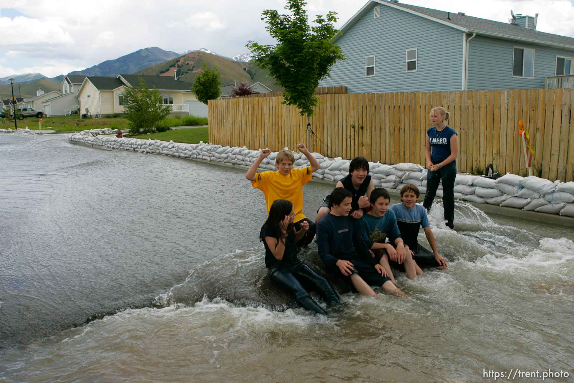 Kids playing in flood water. Flooding along 700 South in Tooele Tuesday.