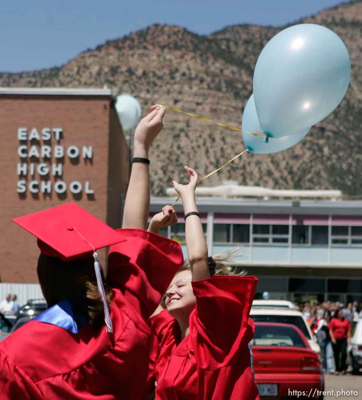 Stephanie Richens (facing) and her classmates released balloons following the final graduation at East Carbon High School.