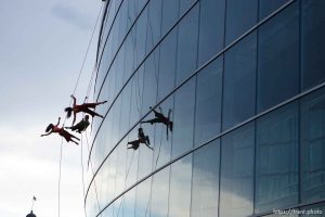 Dancers from Project Bandaloop perform aerial acrobatics on the south face of the Salt Lake City downtown library, during a performance at the Utah Arts Festival Saturday evening. 6.25.2005