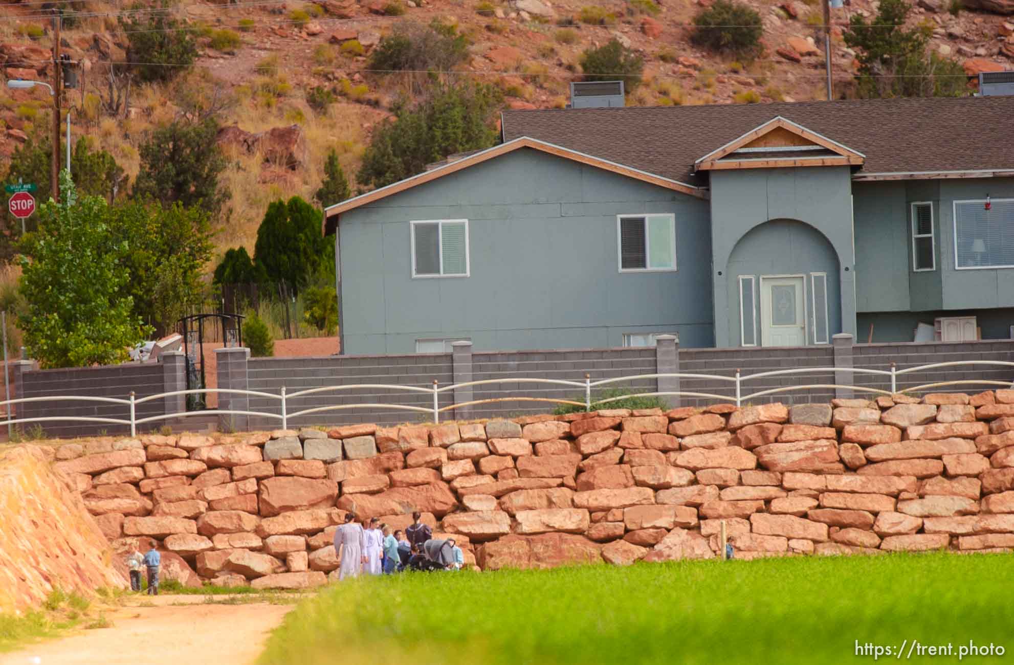 People in field. Colorado City/Hildale.