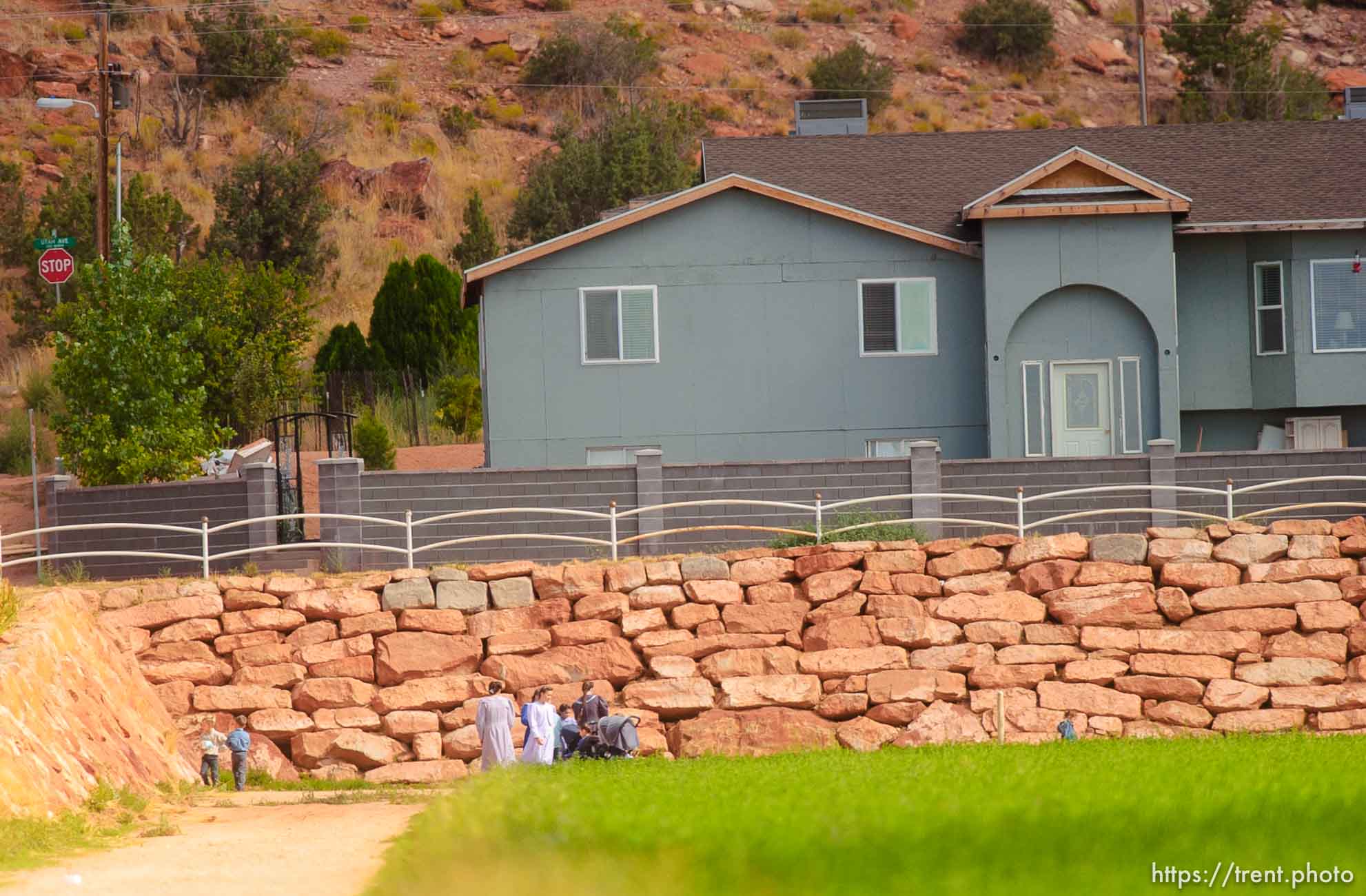 People in field. Colorado City/Hildale.