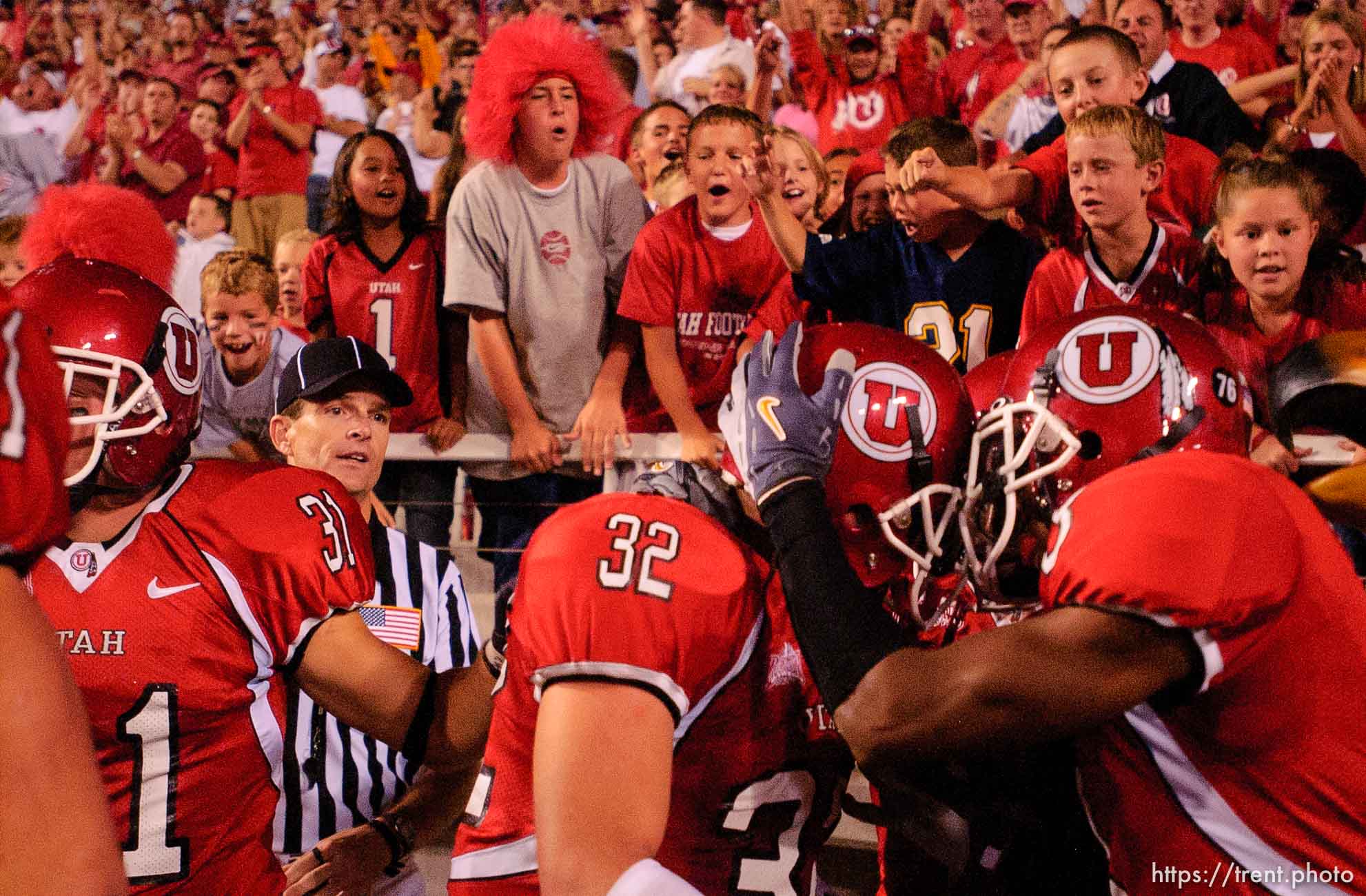 fans. Utah's Eugene Oates (right) celebrates with Eric Weddle after Weddle scored a touchdown on an interception, third quarter. Utah vs. Arizona college football Friday night at Rice-Eccles Stadium.