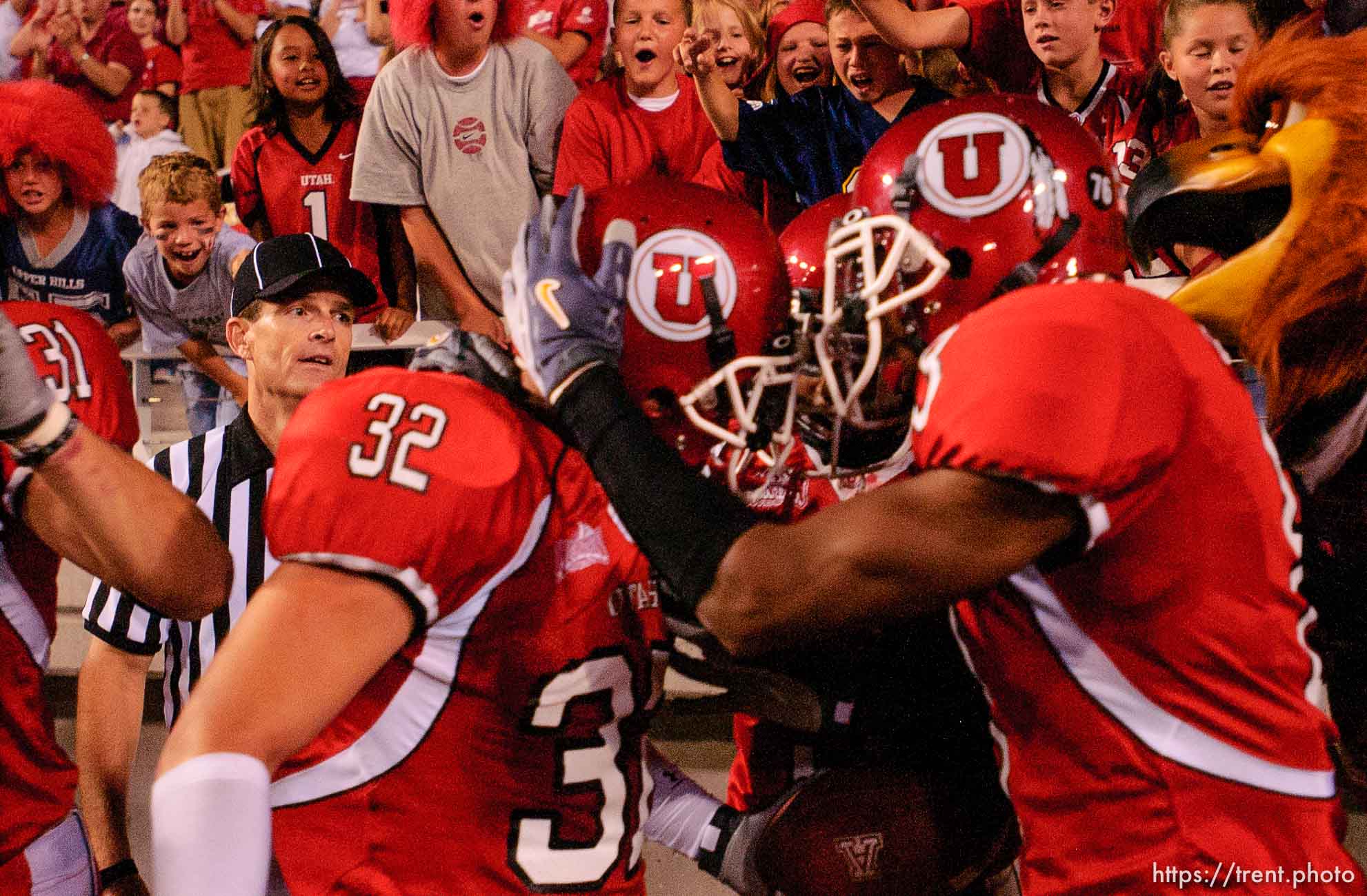 fans. Utah's Eugene Oates (right) celebrates with Eric Weddle after Weddle scored a touchdown on an interception, third quarter. Utah vs. Arizona college football Friday night at Rice-Eccles Stadium.