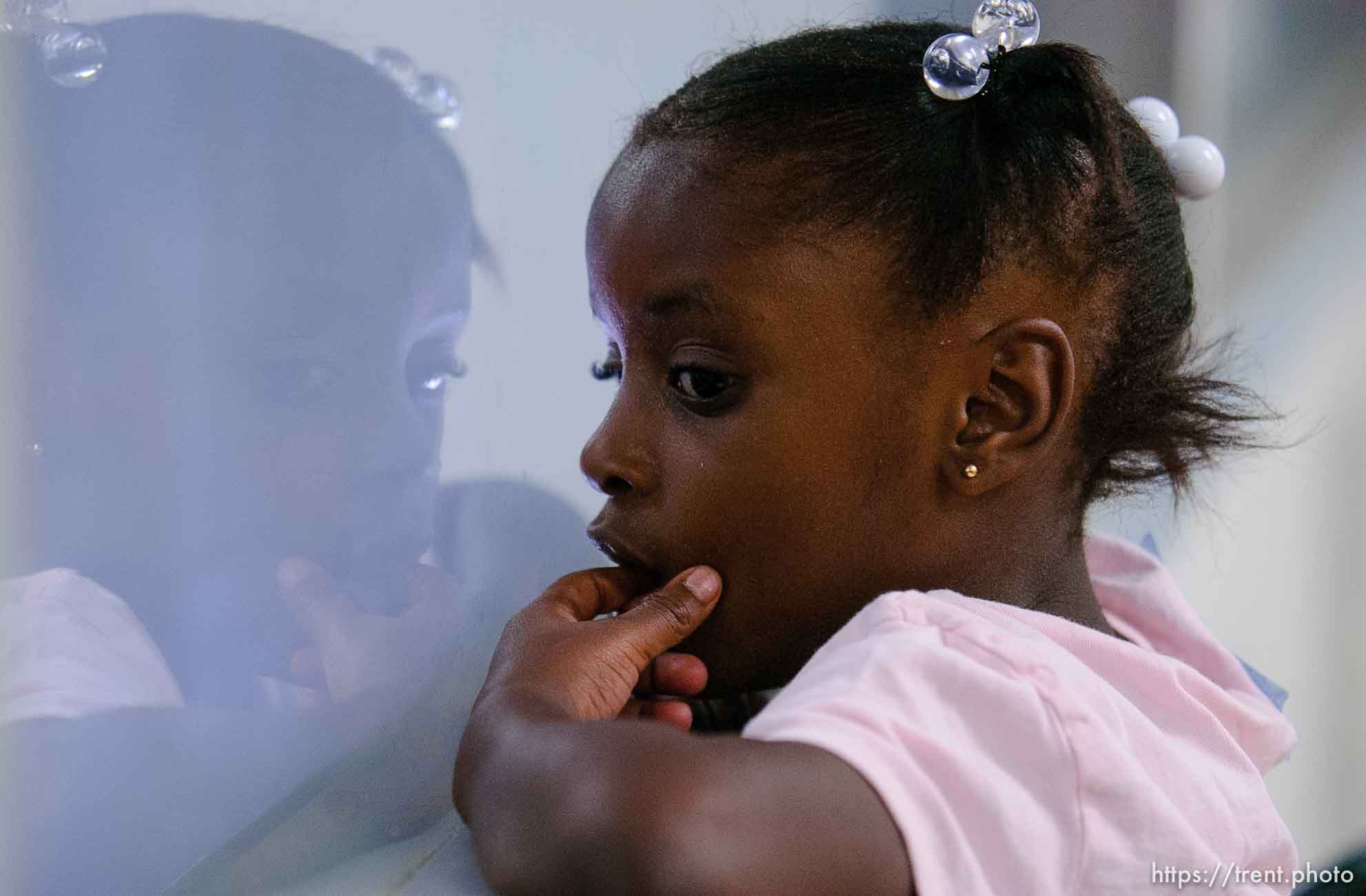 girl in day care center at Camp Williams, where people who were evacuated from the hurricane Katrina disaster in New Orleans, are making a go of it.