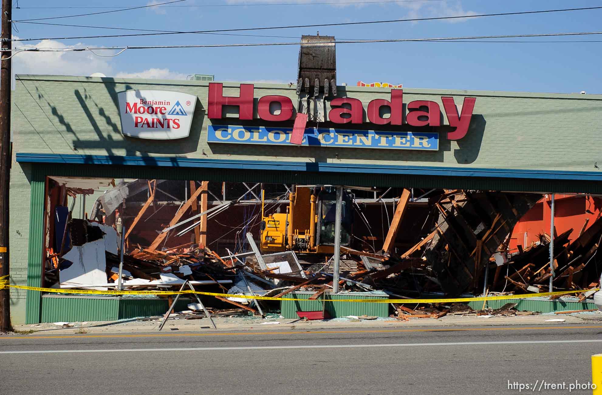 Destruction of the Video Vern's building at 4800 South Holladay Boulevard began Friday afternoon. The building to the south of Video Vern's, which house the Holladay Color Center paint store for approximately forty years, was demolished Friday afternoon.