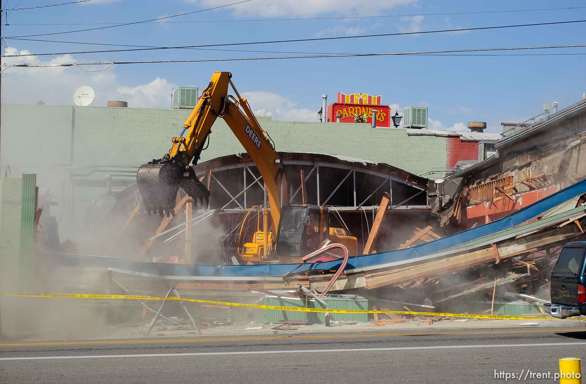 Destruction of the Video Vern's building at 4800 South Holladay Boulevard began Friday afternoon. The building to the south of Video Vern's, which house the Holladay Color Center paint store for approximately forty years, was demolished Friday afternoon.