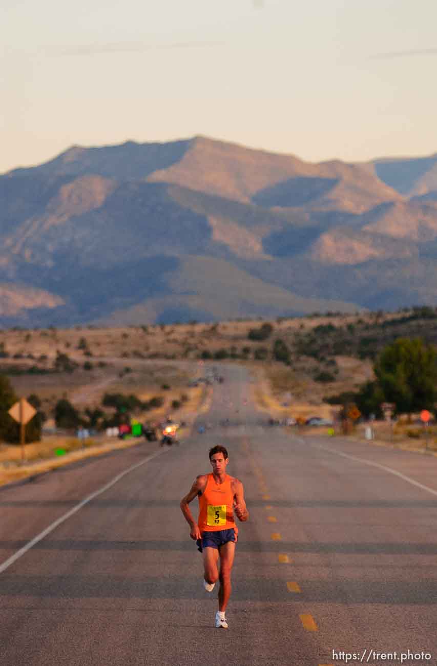 the day's first sunlight hits leader Isaac Barnes. St. George Marathon