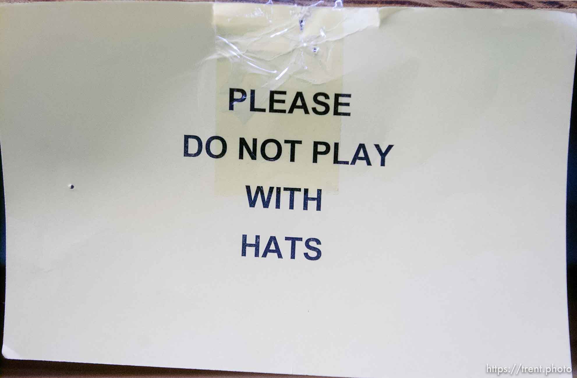 please do not play with hats sign. Salt Lake Costume Co., founded in 1889, closed Saturday, and sold its remaining property at an auction Tuesday. Rob Olson was the auctioneer.