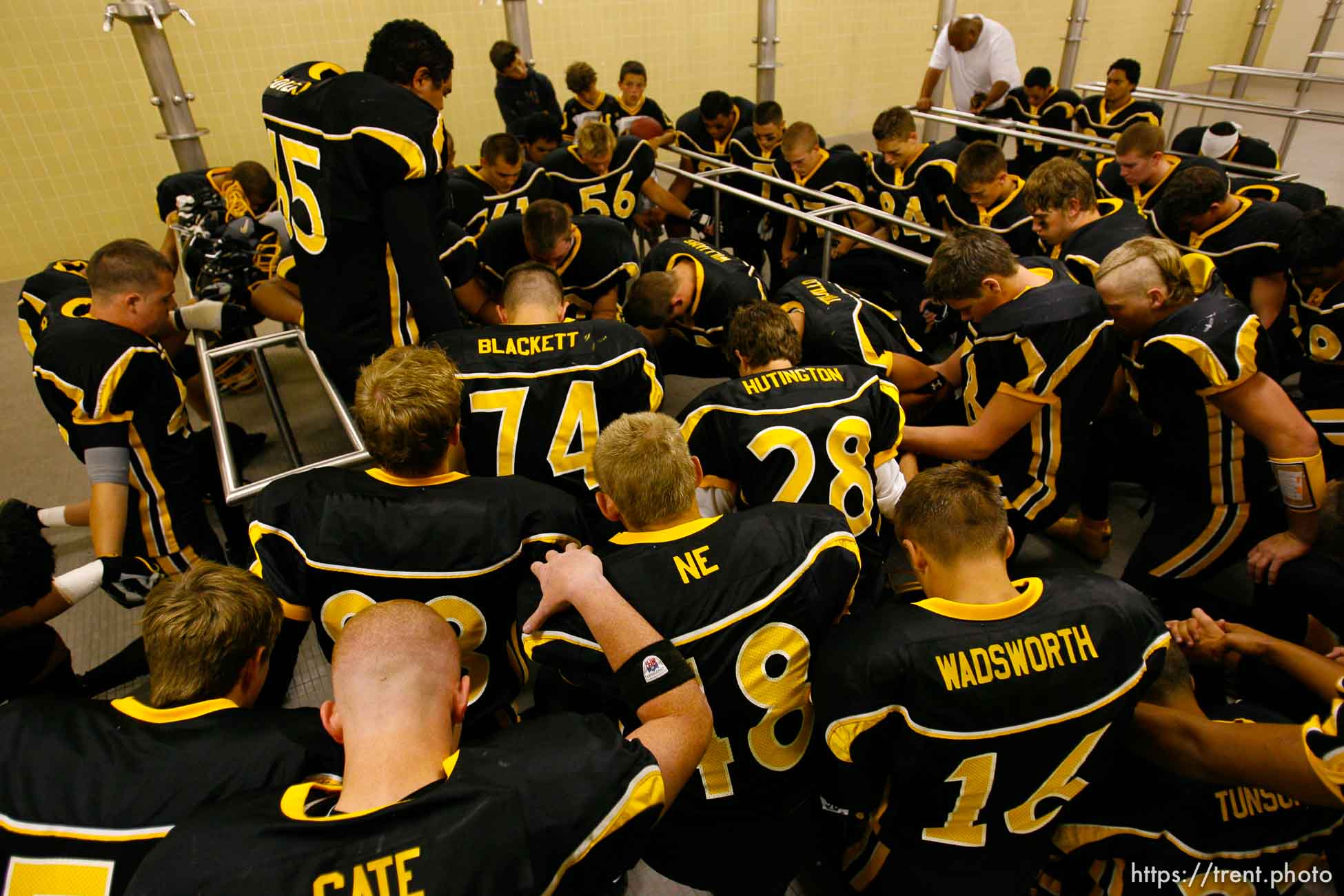 Cottonwood team prayer pre-game in the locker room. Cottonwood vs. Highland high school football.