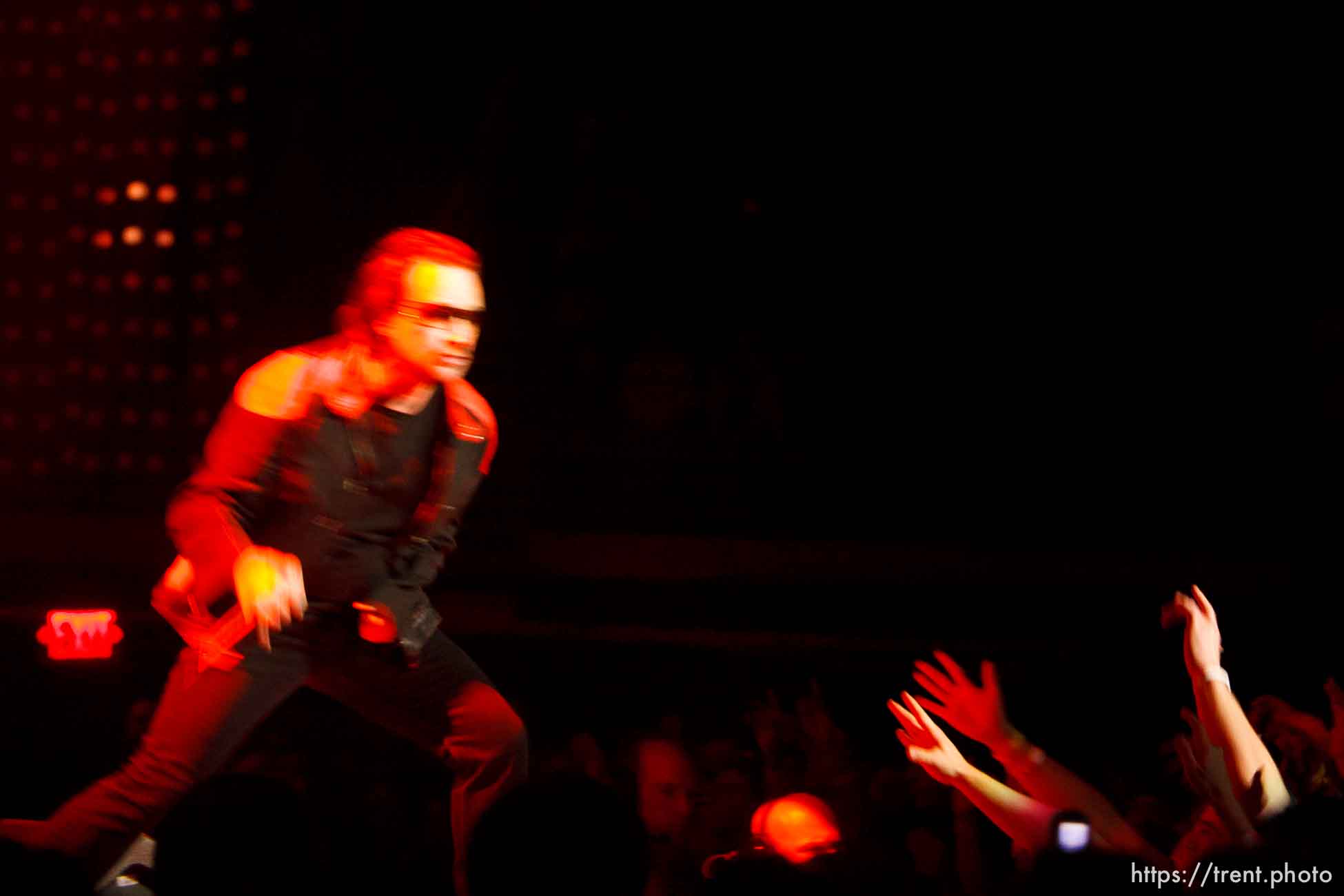 U2 performs at the Delta Center.