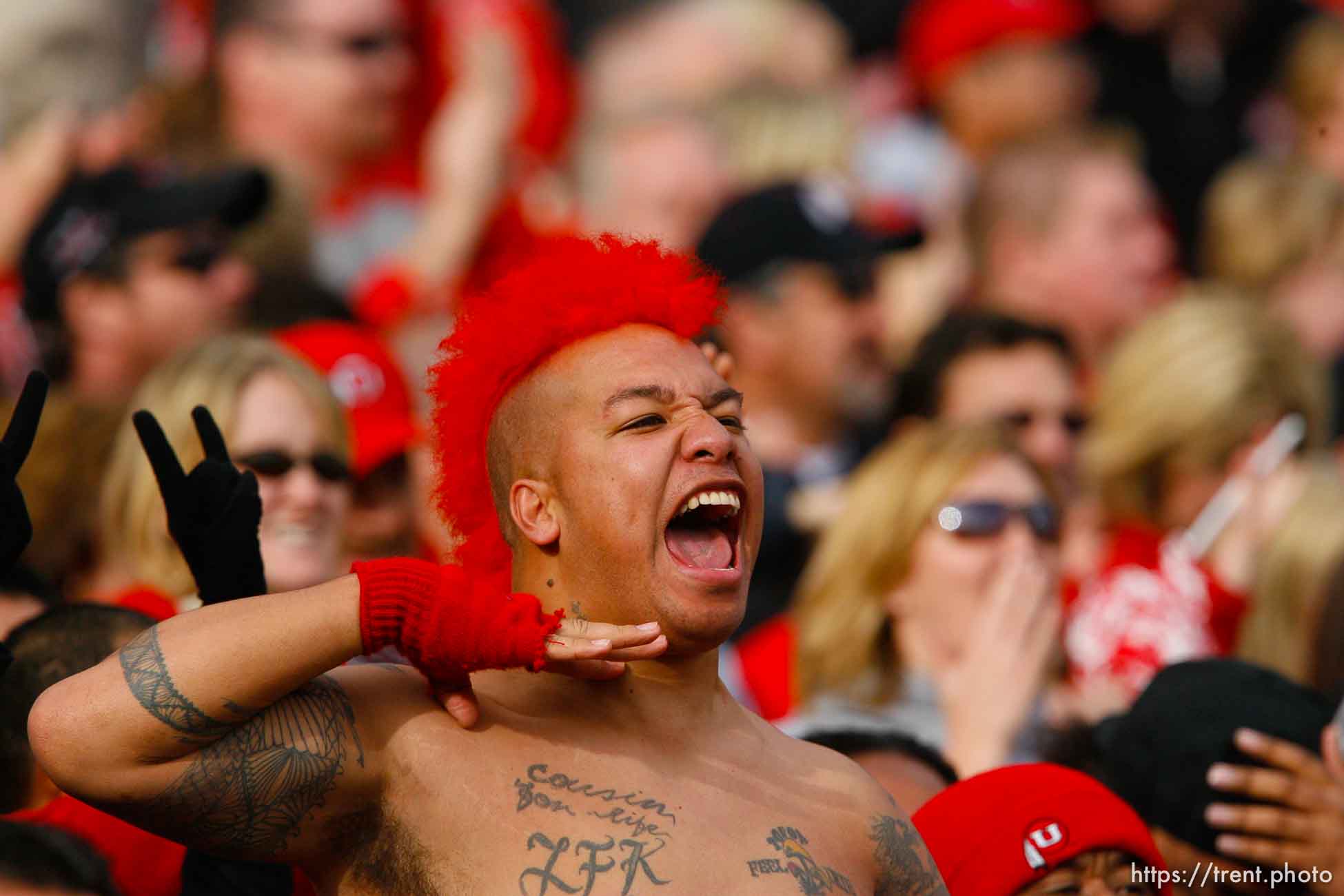 Utah fan draws his hand across his neck after Utah's Steve Tate intercepted a Georgia Tech pass, first half. University of Utah vs. Georgia Tech, Emerald Bowl, San Francisco.