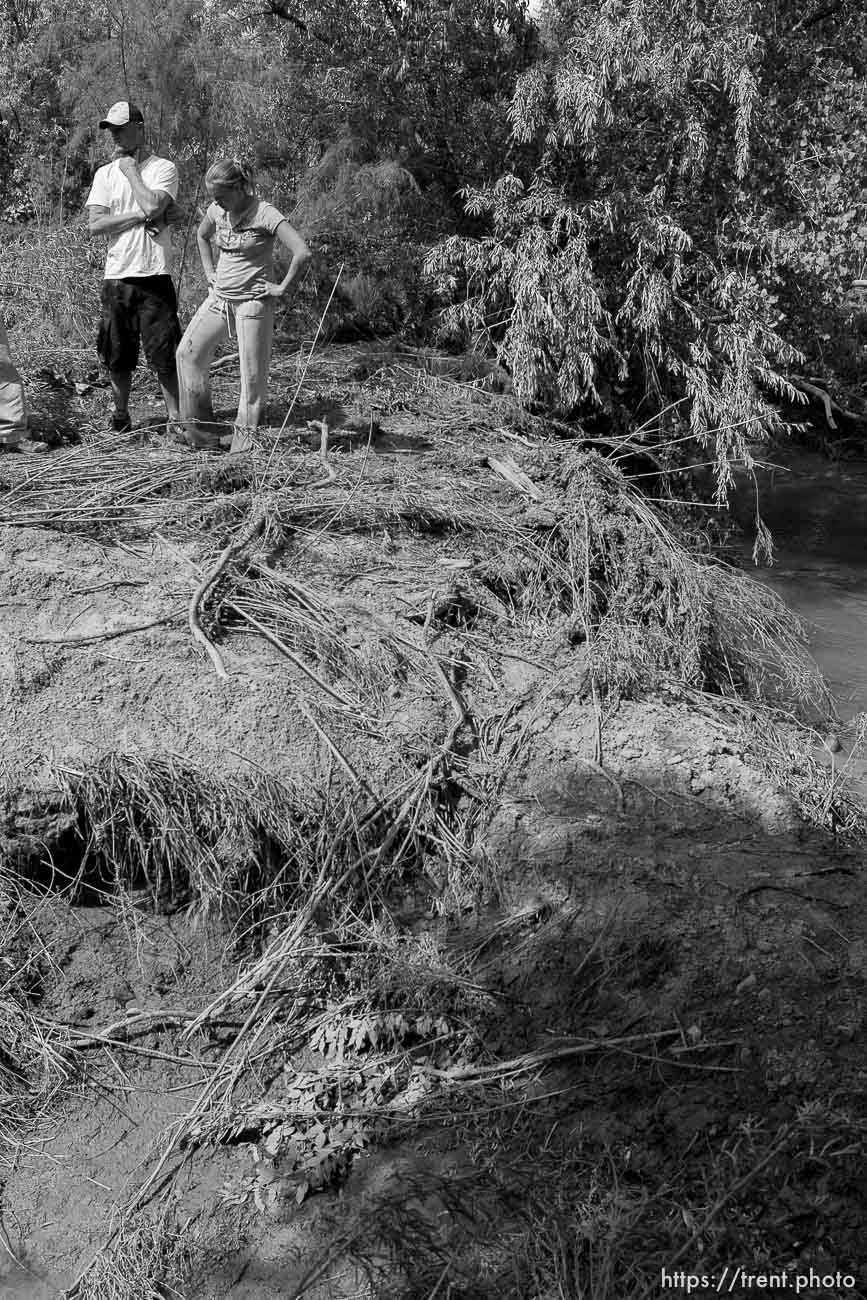 Helper - Courtney and Josh Seal continue to search the Price River for the body of their missing one-year-old son Jayden, who was washed away when a flash flood slammed into the family's vehicle July 30. The couple's 5-year-old son Levi died in the accident.; 8.17.2006