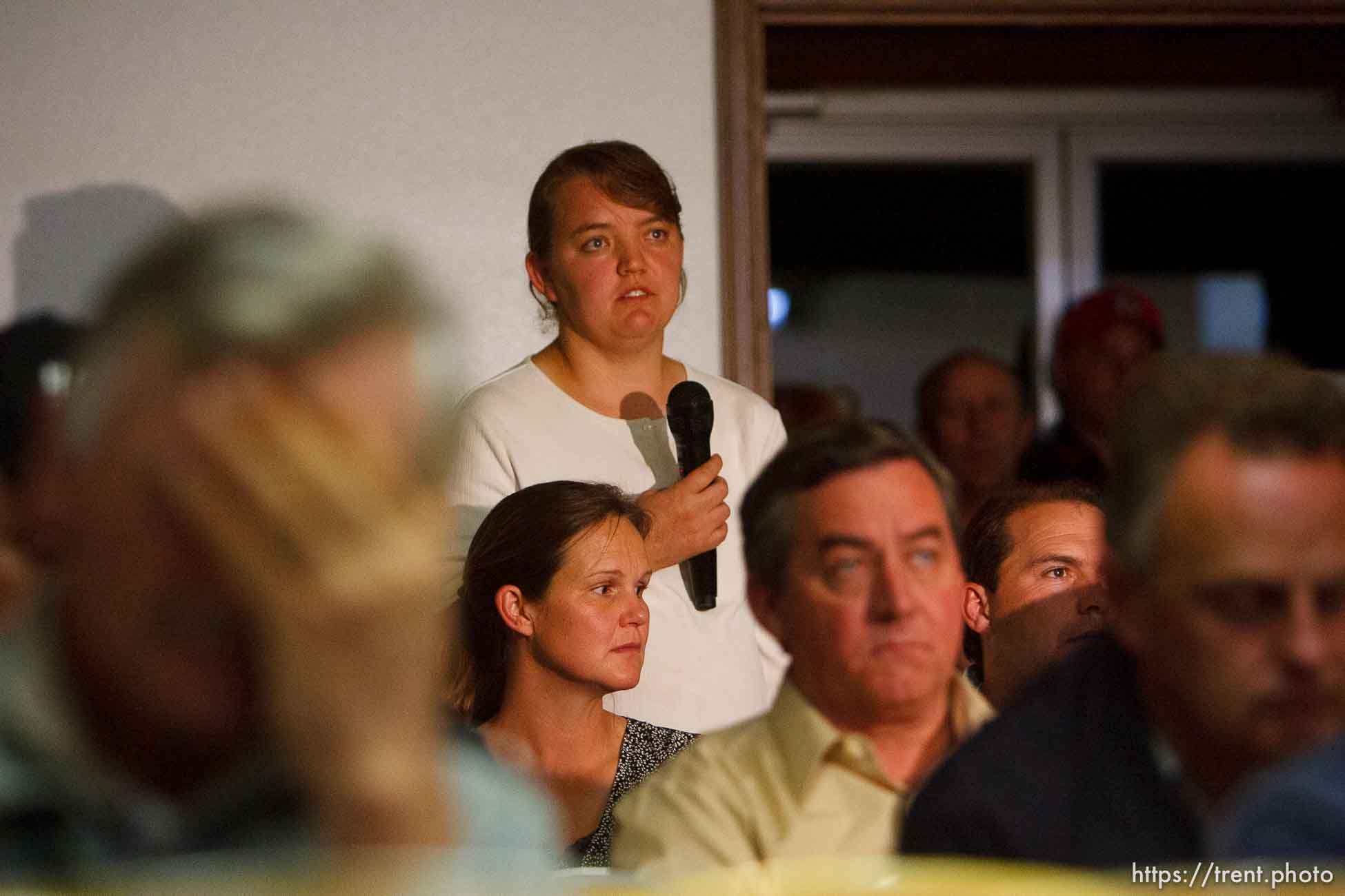 Hildale - Mary Ann Harker asks a question during a Q&A with Special Fiduciary Bruce Wisan. Wisan addressed residents of Hildale, UT and Colorado City, AZ, providing details on the United Effort Plan (UEP) property trust at a meeting held at the Hildale City Hall.