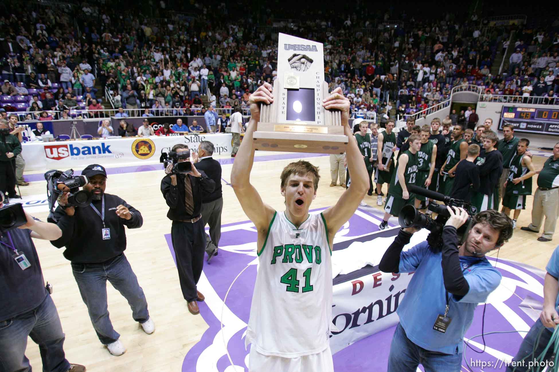 Provo's Chris Collinsworth celebrates the championship with the trophy. Ogden - Provo vs. Payson High School boys basketball, 4A State Basketball Championship Game at the Dee Events Center Wednesday.