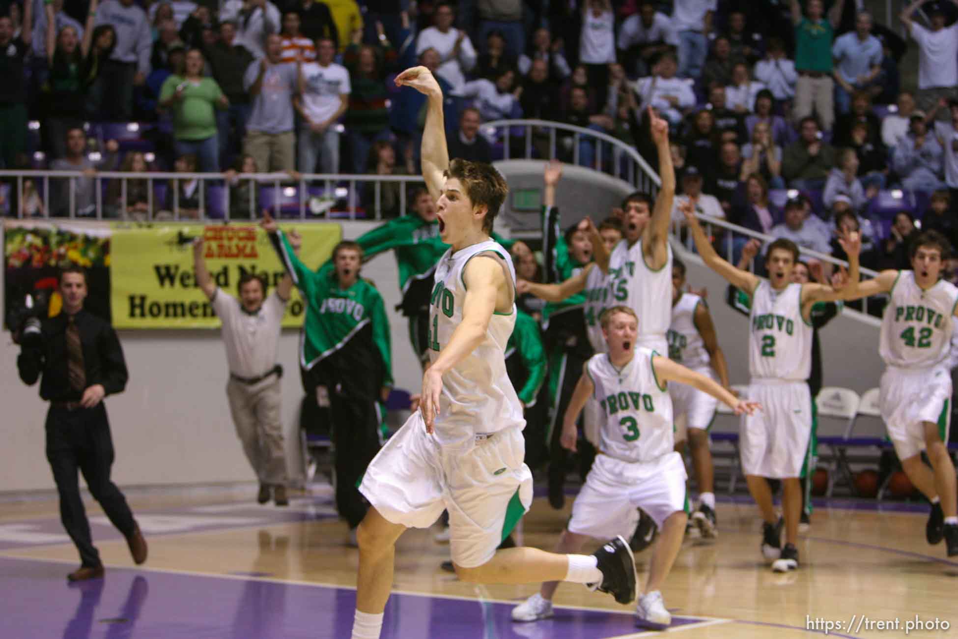 Ogden - Provo's Chris Collinsworth (frontmost) and his teammates celebrate their state championship win over Payson. Provo vs. Payson High School boys basketball, 4A State Basketball Championship Game at the Dee Events Center Wednesday.