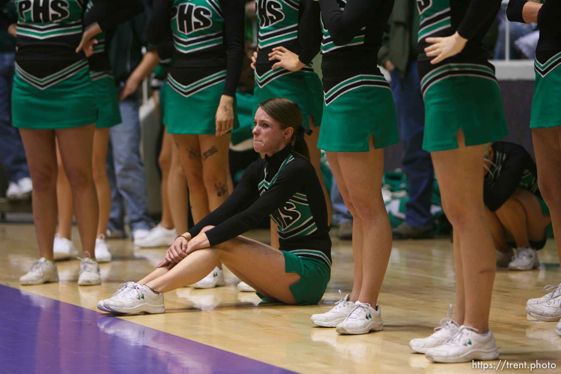 Ogden - Payson cheerleader Kristin Newbold cries on the court after her team lost and Provo took the state championship. Provo vs. Payson High School boys basketball, 4A State Basketball Championship Game at the Dee Events Center Wednesday.