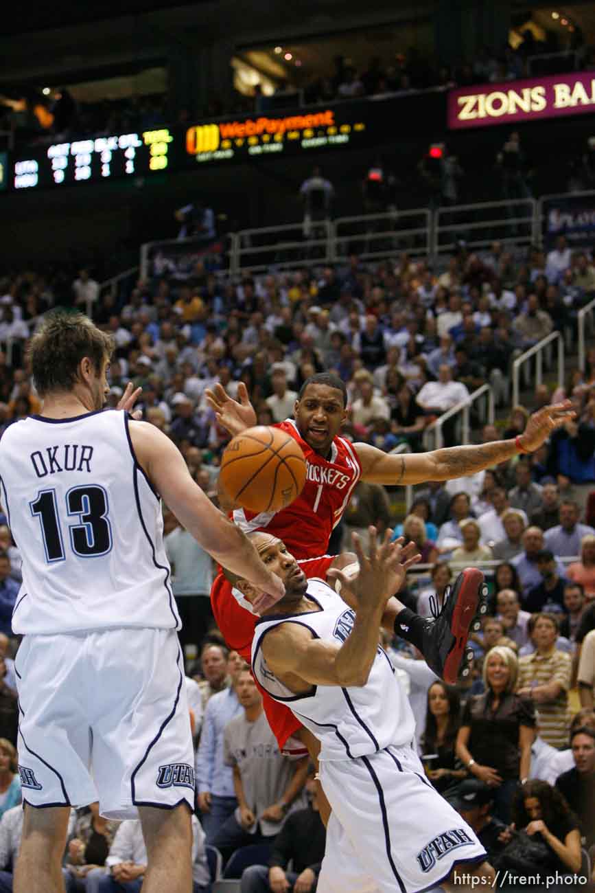 Salt Lake City - Utah Jazz guard Derek Fisher (2) knocks the ball away from Tracy McGrady (top). Utah Jazz vs. Houston Rockets, game 6, NBA playoffs first round.  Jazz win 94-82