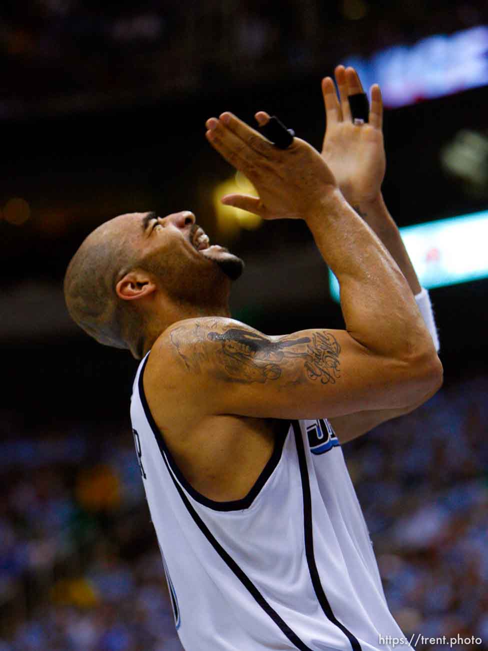 Utah Jazz forward Carlos Boozer (5) lets out a yell after scoring on the foul for a three-point play. Salt Lake City - Utah Jazz vs. Golden State Warriors, NBA Playoffs basketball, second round, Game Two, at EnergySolutions Arena.