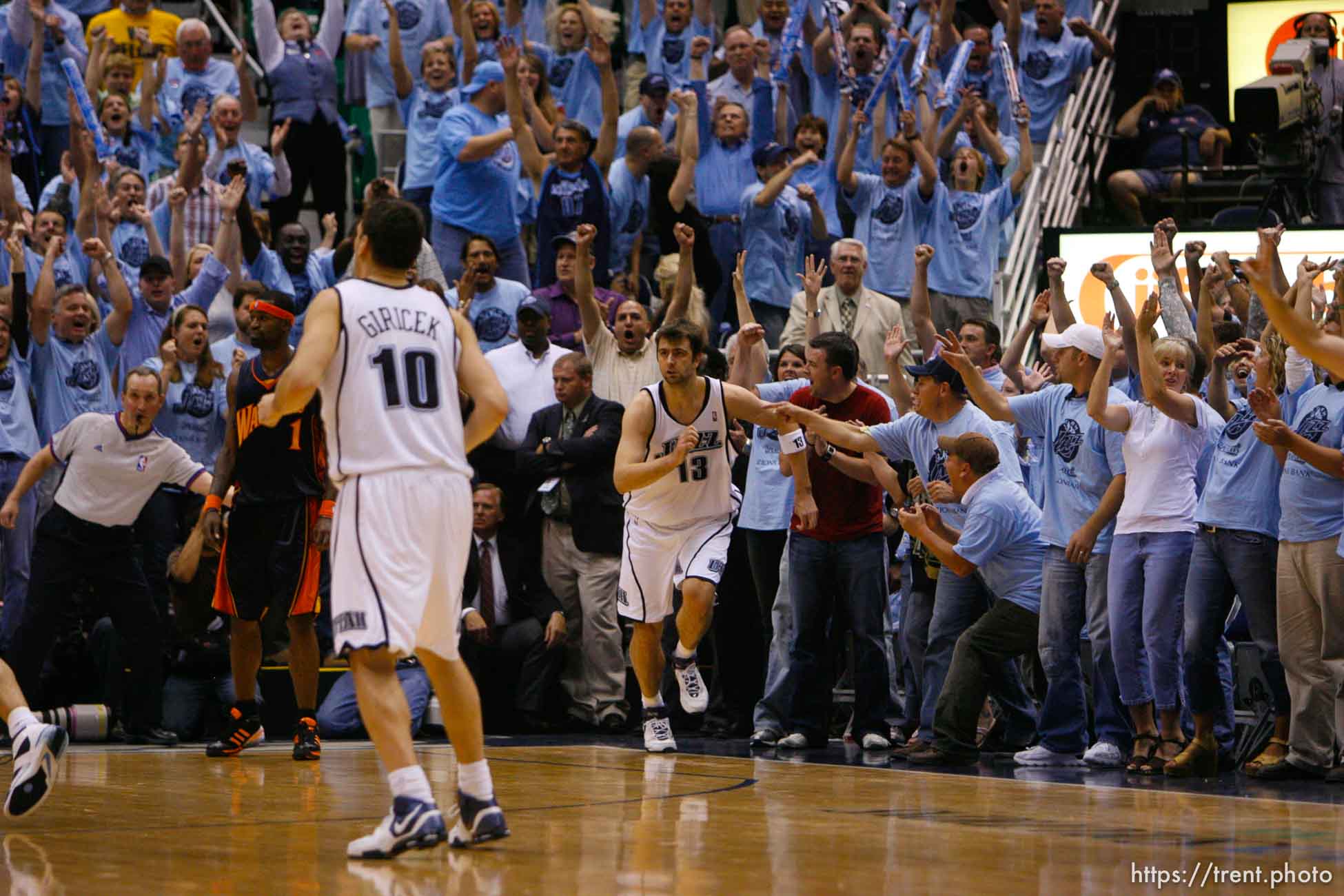 Salt Lake City - Jazz fans jump out of their seats after Utah Jazz center Mehmet Okur (13), of Turkey, hit a crucial shot near the end of regulation. Utah Jazz vs. Golden State Warriors, NBA Playoffs basketball, second round, Game Two, at EnergySolutions Arena.