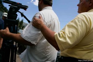 Huntington - Robert Murray, president and CEO of Ohio-based Murray Energy Corp, led reporters on a tour of the Crandall Canyon coal mine Wednesday, where six miners remained trapped. emery county sheriff lamar guymon escorts KSL photographer away from the tour