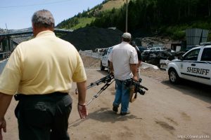 Huntington - Robert Murray, president and CEO of Ohio-based Murray Energy Corp, led reporters on a tour of the Crandall Canyon coal mine Wednesday, where six miners remained trapped. emery county sheriff lamar guymon escorts KSL photographer away from the tour