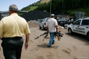 Huntington - Robert Murray, president and CEO of Ohio-based Murray Energy Corp, led reporters on a tour of the Crandall Canyon coal mine Wednesday, where six miners remained trapped. emery county sheriff lamar guymon escorts KSL photographer away from the tour