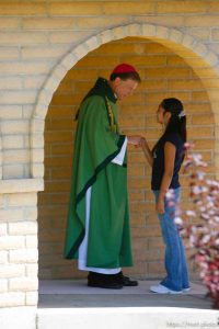 Huntington - Bishop John Wester greets churchgoers before leading a special Mass in Huntington at the San Rafael Mission for family members of the six trapped miners in the Crandall Canyon mine.