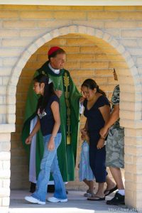 Huntington - Bishop John Wester greets churchgoers before leading a special Mass in Huntington at the San Rafael Mission for family members of the six trapped miners in the Crandall Canyon mine.