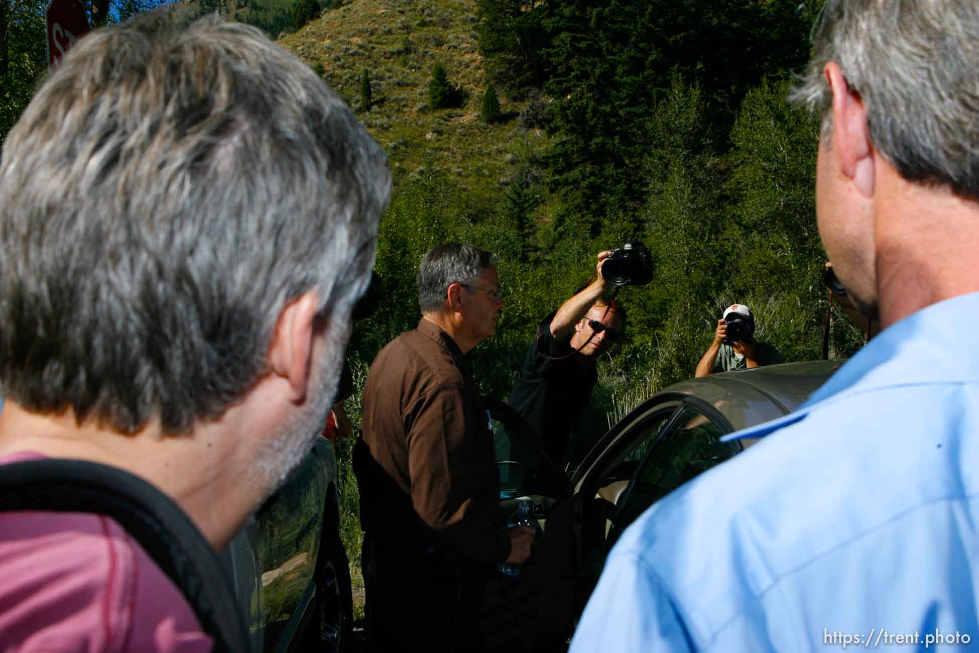 Huntington - Richard Strickler, Assistant Secretary for the Mine Safety and Health Administration, gets into his car surrounded by reporters and cameramen after a press conference Friday morning at the command post for the Crandall Canyon Mine rescue effort.