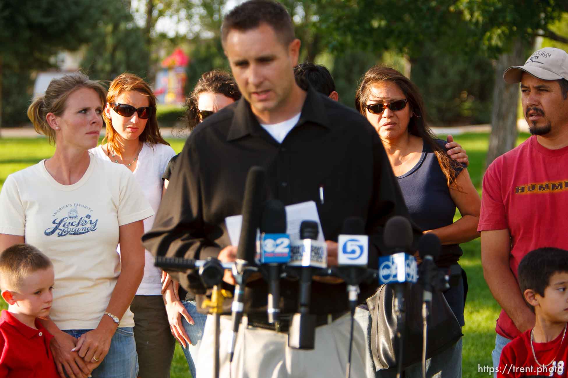 Huntington - Family members of miners missing in the Crandall Canyon coal mine stand with spokesman Sonny Olsen as he reads their statement to the media in the Huntington City Park. The family members wished to remain unidentified.
; 8.23.2007