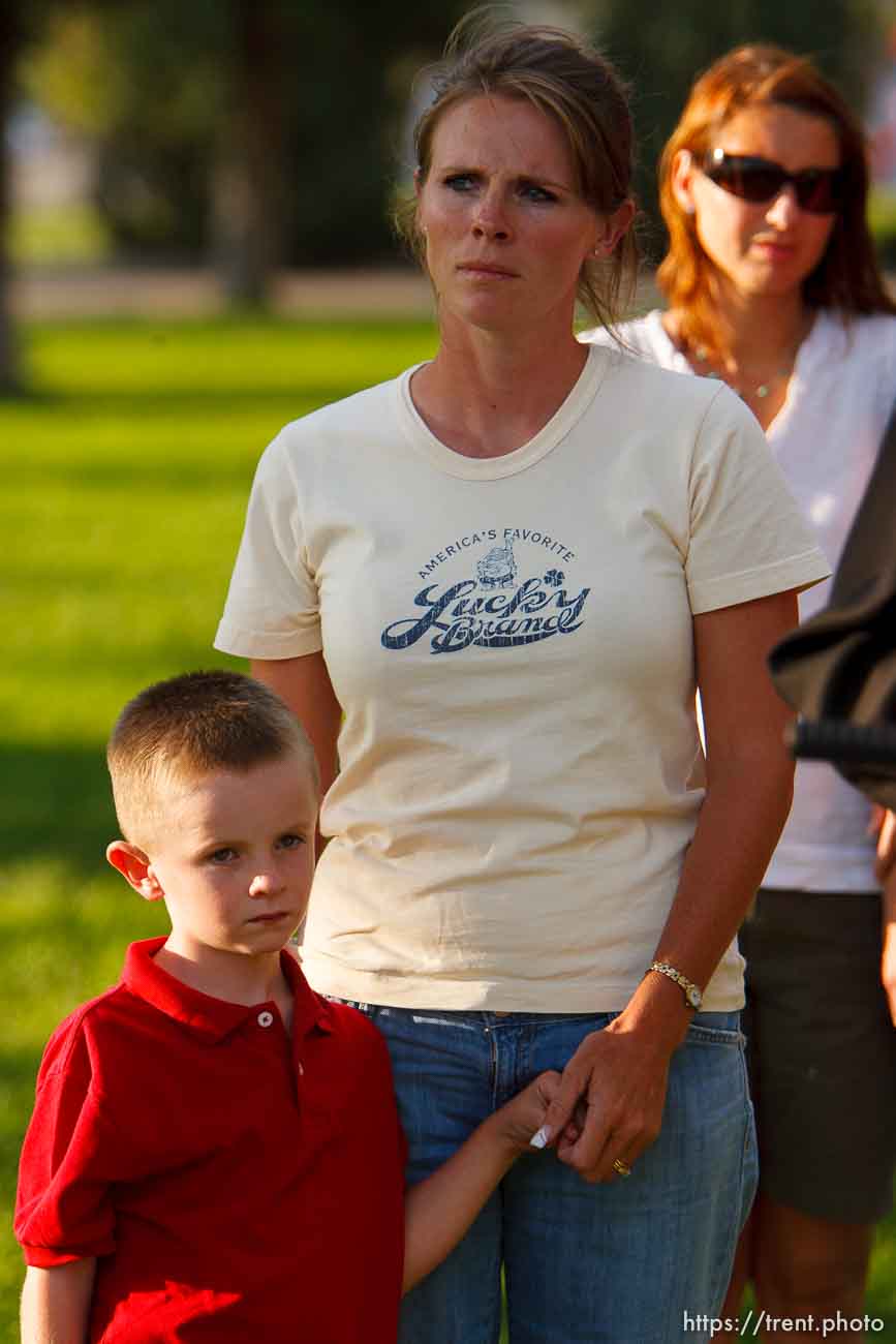 Huntington - Family members of miners missing in the Crandall Canyon coal mine stand with spokesman Sonny Olsen as he reads their statement to the media in the Huntington City Park. The family members wished to remain unidentified.
; 8.23.2007