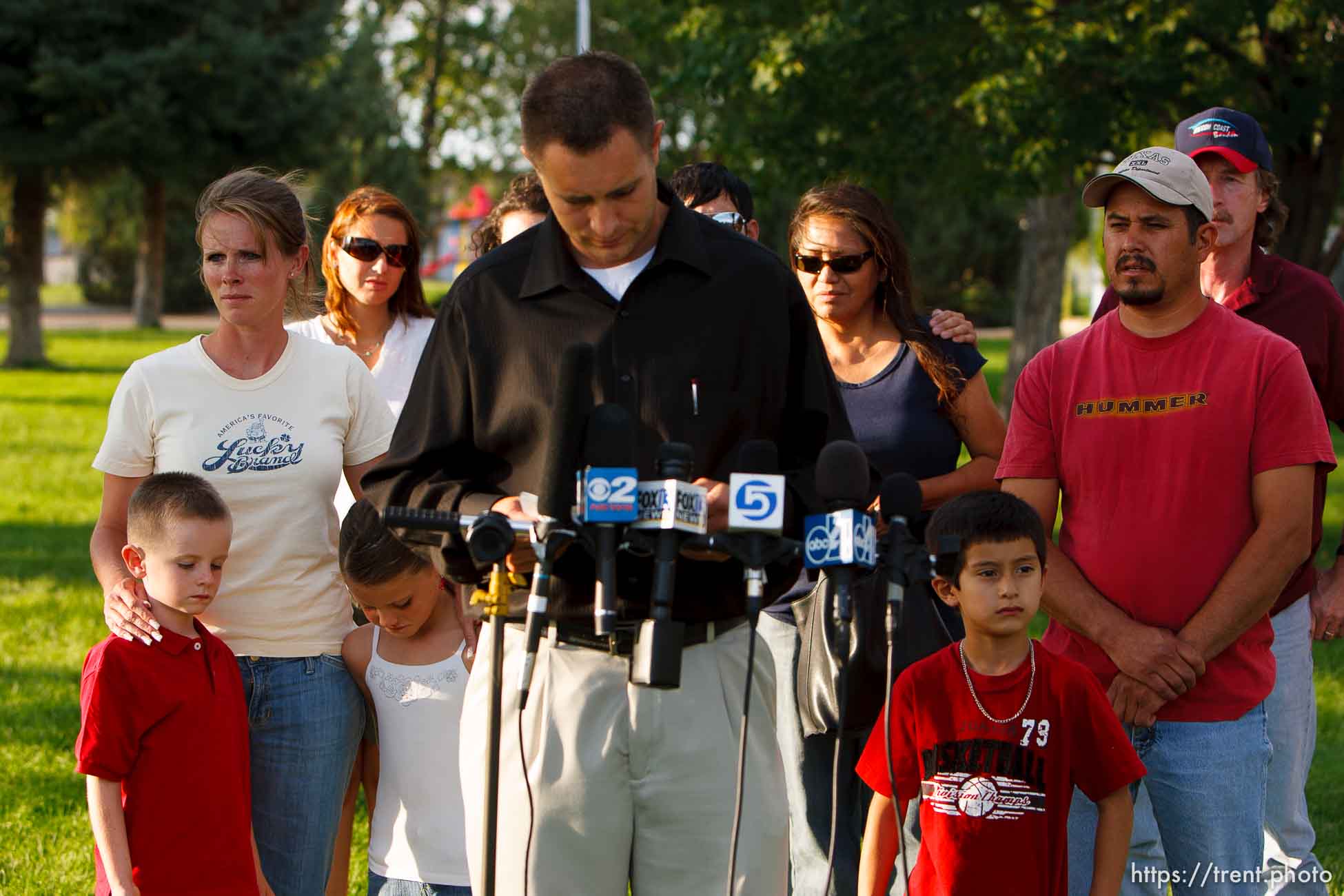 Huntington - Family members of miners missing in the Crandall Canyon coal mine stand with spokesman Sonny Olsen as he reads their statement to the media in the Huntington City Park. The family members wished to remain unidentified.
; 8.23.2007