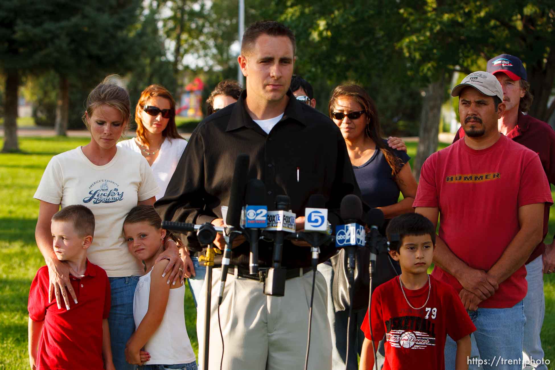 Huntington - Family members of miners missing in the Crandall Canyon coal mine stand with spokesman Sonny Olsen as he reads their statement to the media in the Huntington City Park. The family members wished to remain unidentified.
; 8.23.2007