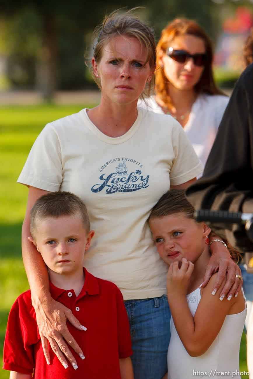 Huntington - Family members of miners missing in the Crandall Canyon coal mine stand with spokesman Sonny Olsen as he reads their statement to the media in the Huntington City Park. The family members wished to remain unidentified.
; 8.23.2007