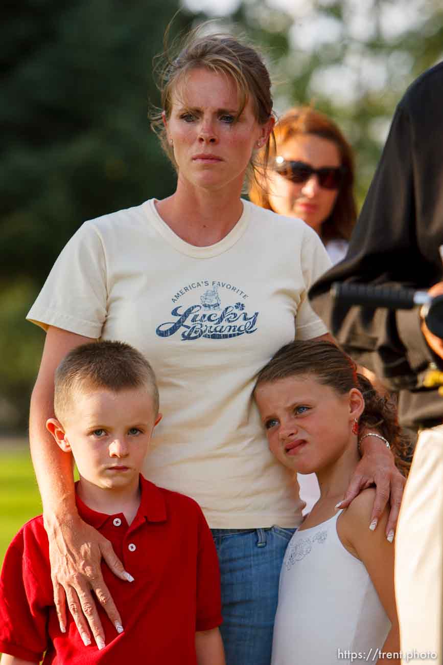 Huntington - Family members of miners missing in the Crandall Canyon coal mine stand with spokesman Sonny Olsen as he reads their statement to the media in the Huntington City Park. The family members wished to remain unidentified.
; 8.23.2007