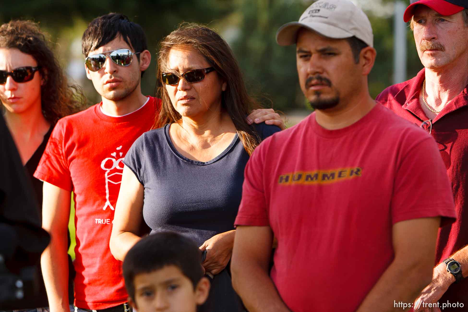 Huntington - Family members of miners missing in the Crandall Canyon coal mine stand with spokesman Sonny Olsen as he reads their statement to the media in the Huntington City Park. The family members wished to remain unidentified.
; 8.23.2007