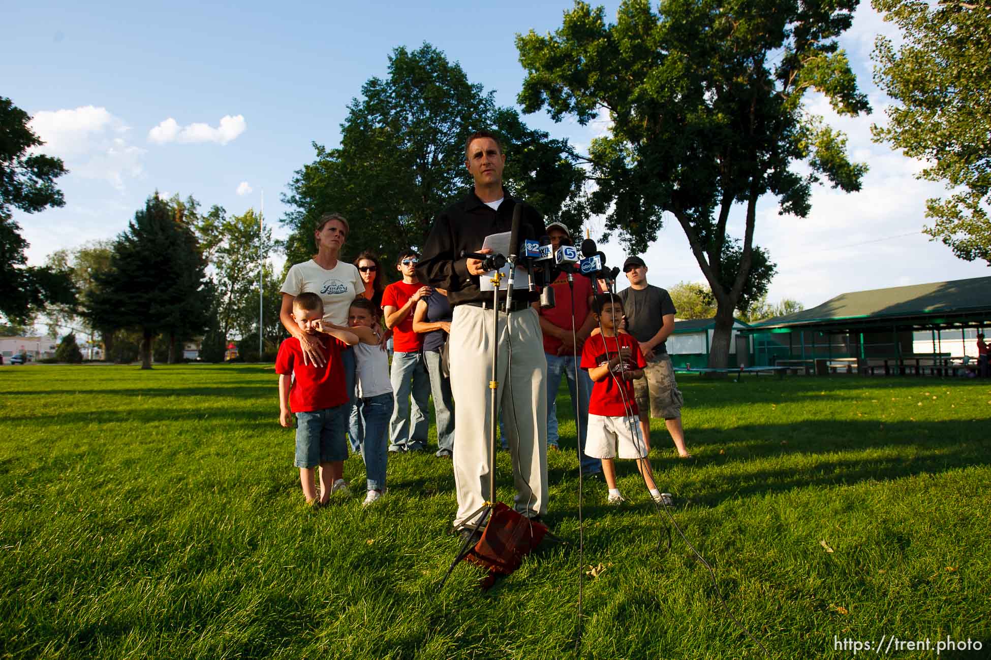 Huntington - Family members of miners missing in the Crandall Canyon coal mine stand with spokesman Sonny Olsen as he reads their statement to the media in the Huntington City Park. The family members wished to remain unidentified.
; 8.23.2007