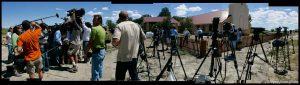 Media crowd around Utah governor Jon Huntsman after a mass for the families of miners trapped in the Crandall Canyon Coal Mine. Tribune reporter Jennifer Sanchez at right.