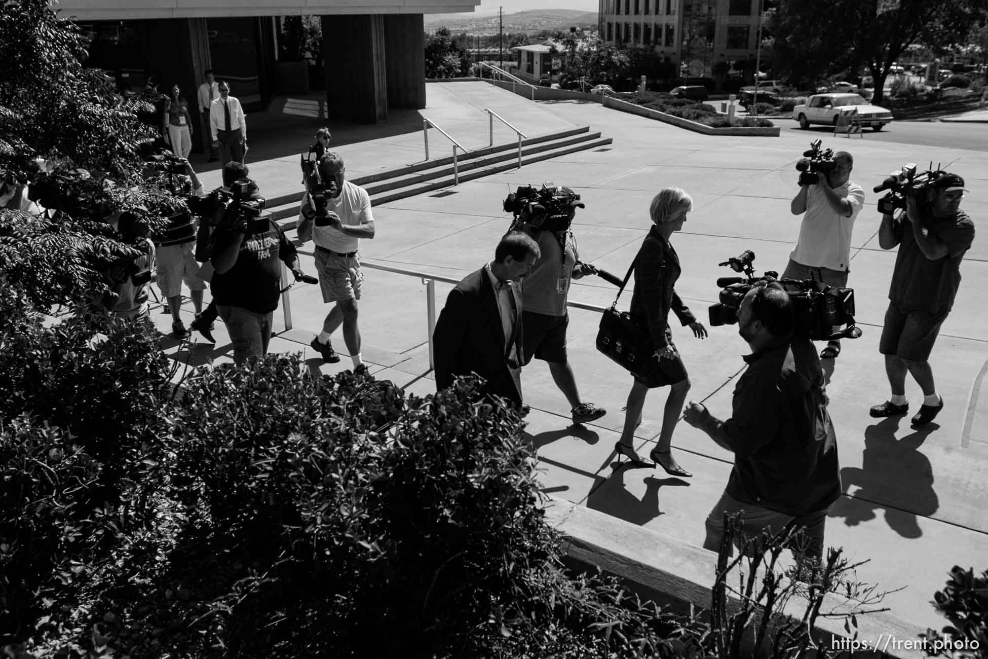 The Warren Jeffs' trial in St. George, Utah. Jeffs, head of the Fundamentalist Church of Jesus Christ of Latter Day Saints, is charged with two counts of rape as an accomplice for allegedly coercing the marriage and rape of a 14-year-old follower to her 19-year-old cousin in 2001. tara isaacson and walter bugden surrounded by cameras. bad white balance