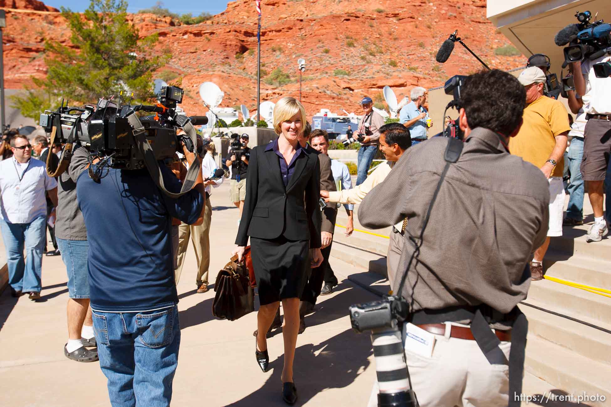 defense attorney Tara Isaacson and media. St. George - Warren Jeffs trial. The polygamous sect leader was charged with two counts of rape as an accomplice stemming from a marriage he officiated involving a 14-year-old girl and her 19-year-old cousin. photographer steve marcus