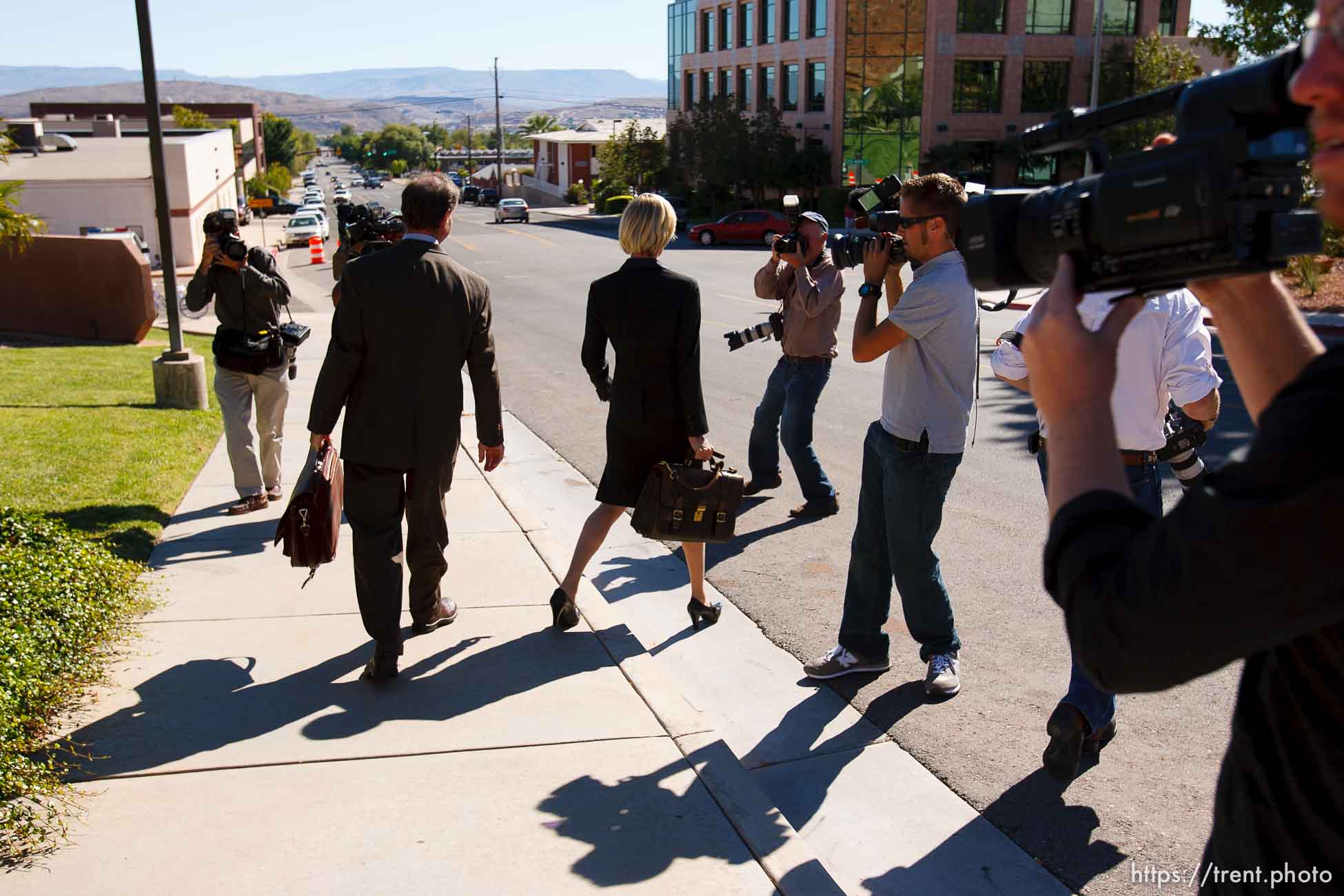 defense attorney Tara Isaacson, Walter Bugden and media. St. George - Warren Jeffs trial. The polygamous sect leader was charged with two counts of rape as an accomplice stemming from a marriage he officiated involving a 14-year-old girl and her 19-year-old cousin. photographer steve marcus, tom smart