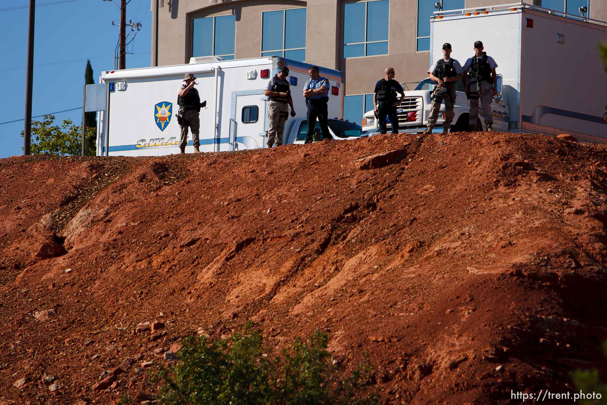 police working security. St. George - Warren Jeffs trial. The polygamous sect leader was charged with two counts of rape as an accomplice stemming from a marriage he officiated involving a 14-year-old girl and her 19-year-old cousin.