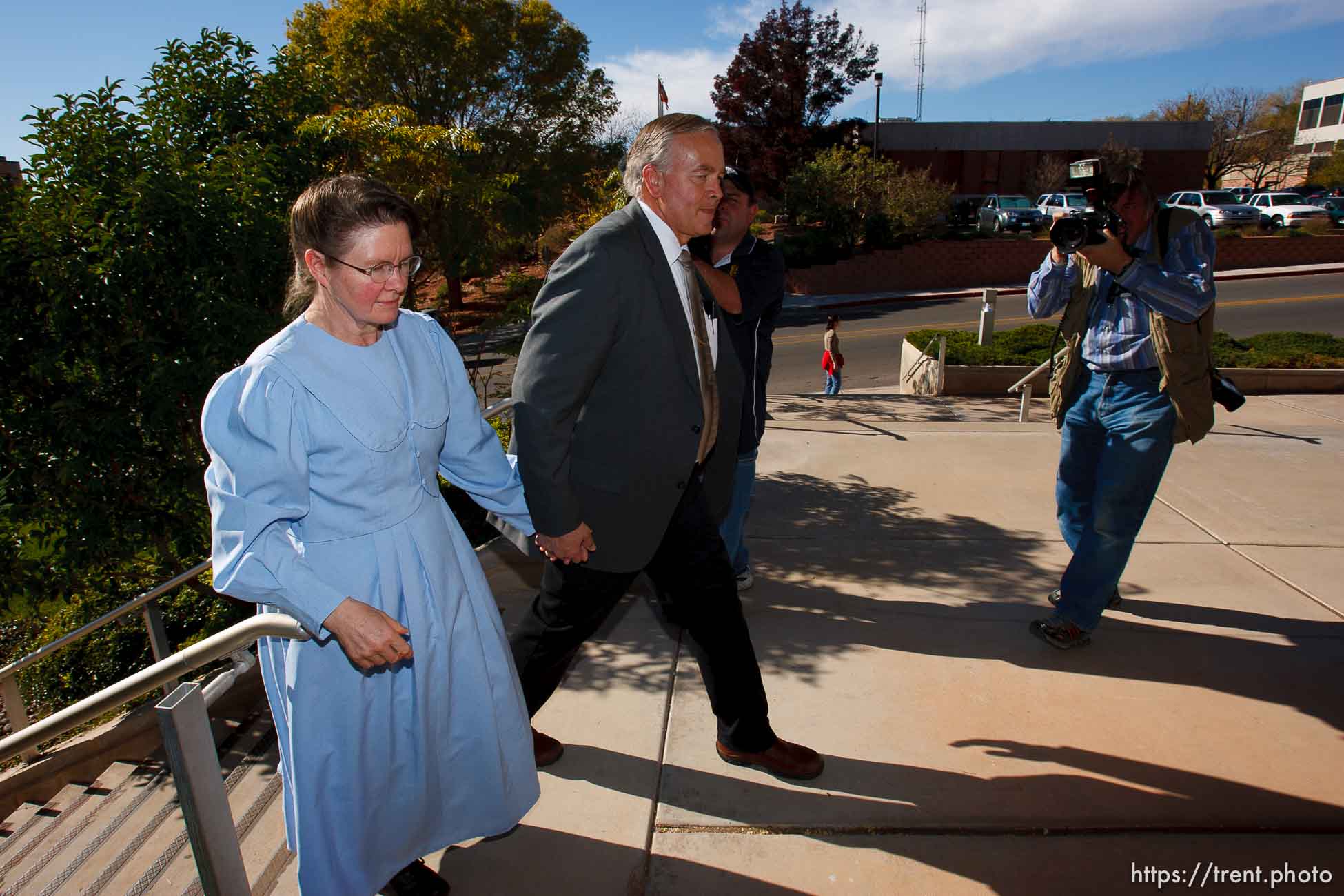 Lamar Johnson and unidentified woman. Doug Pizac at right. St. George - Polygamous sect leader Warren Jeffs was sentenced Tuesday, November 20, 2007 after being found guilty on two counts of rape as an accomplice, in St. George, Utah. Jeffs, head of the Fundamentalist Church of Jesus Christ of Latter Day Saints, was found guilty of two counts of rape as an accomplice for allegedly coercing the marriage and rape of a 14-year-old follower to her 19-year-old cousin in 2001.
; 11.20.2007