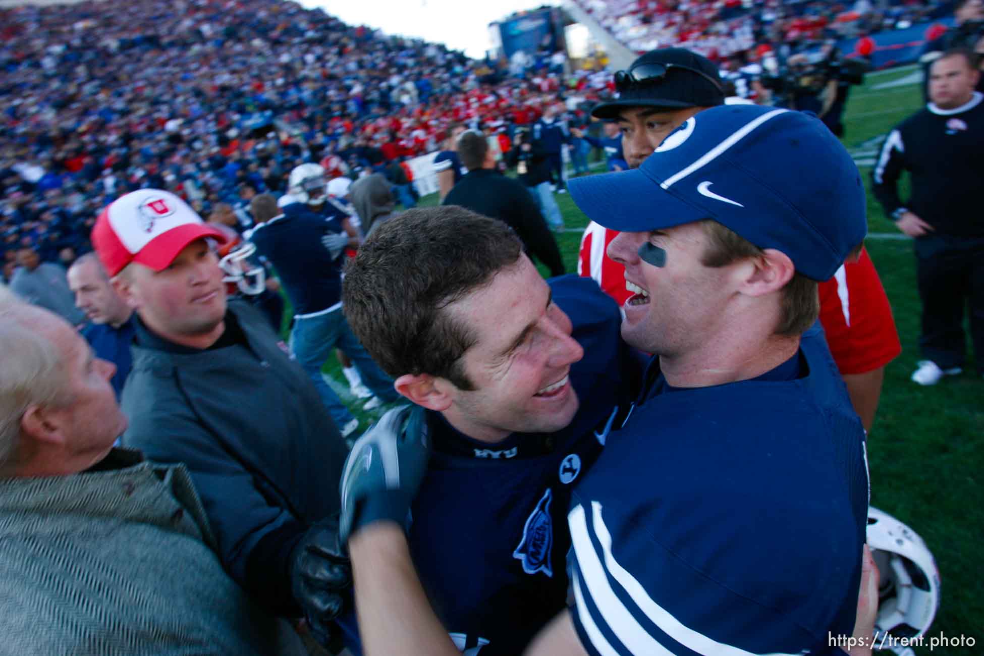 Provo - BYU defeats the University of Utah 17-10 in college football action Saturday at BYU's Lavell Edward Stadium. Brigham Young quarterback Max Hall (15) hugs Brigham Young wide receiver Matt Allen (10) after win