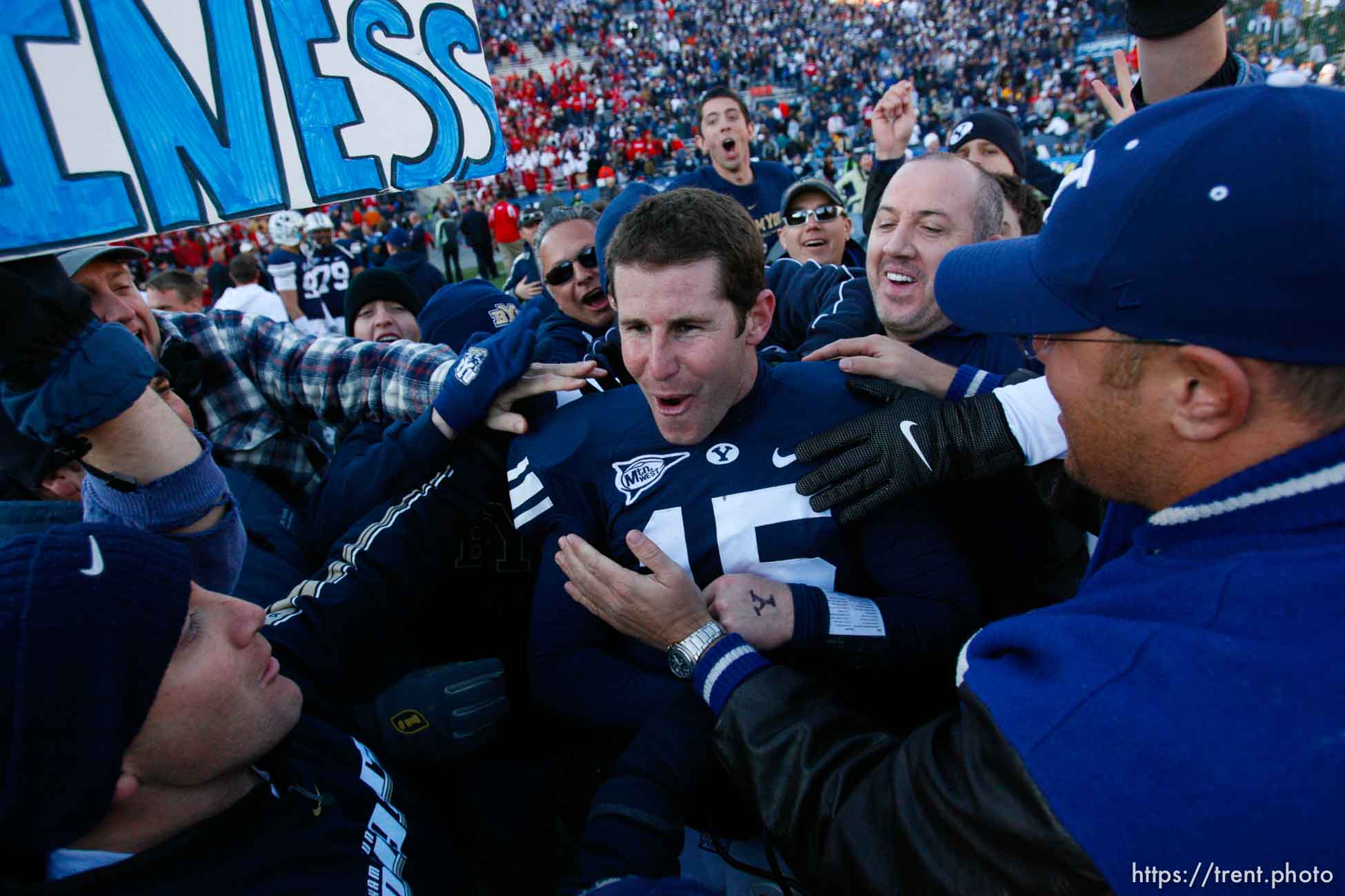 Provo - BYU fans hold Brigham Young quarterback Max Hall (15) on their shoulders, celebrating victory as BYU defeats the University of Utah 17-10 in college football action Saturday at BYU's Lavell Edward Stadium.