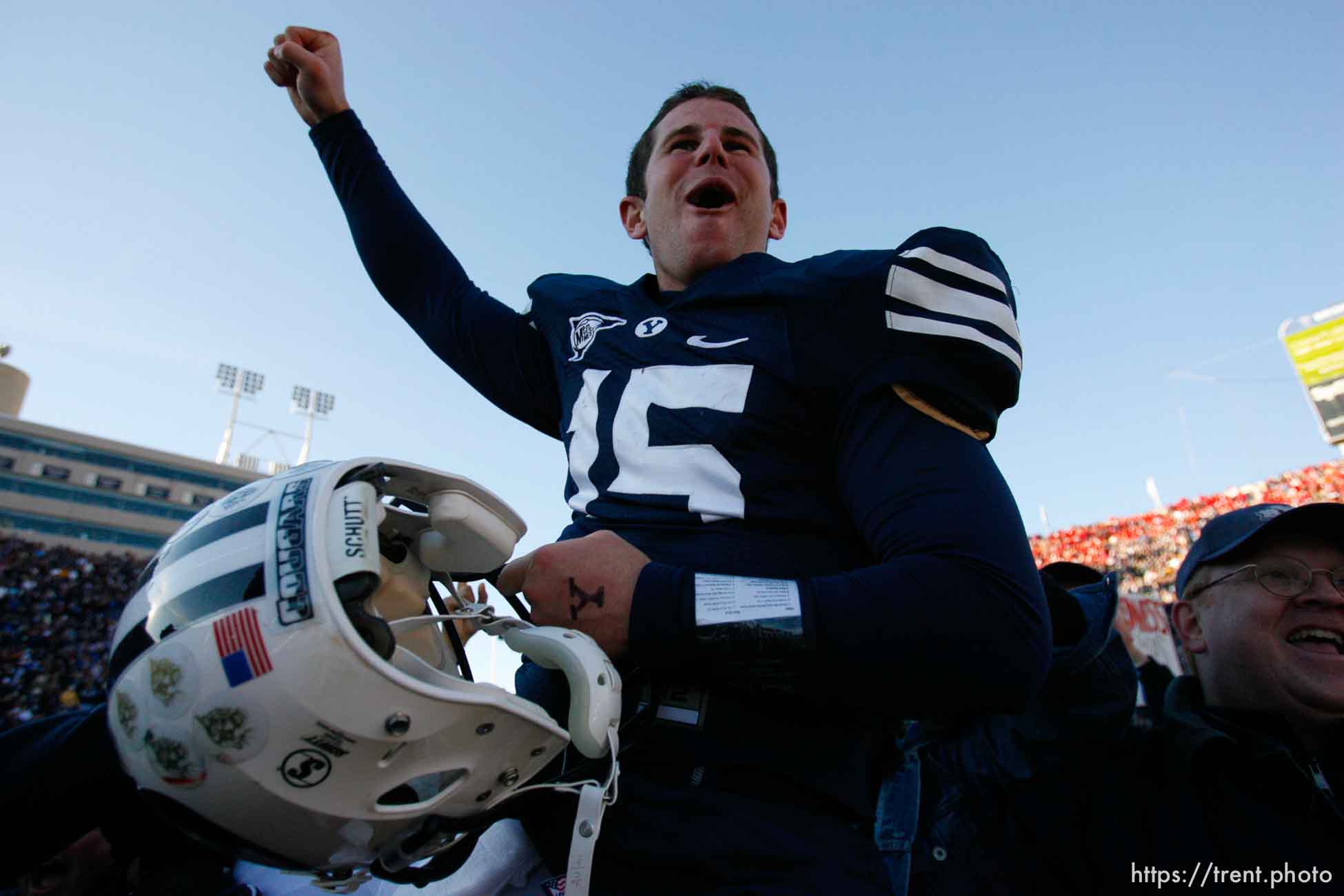 Provo - BYU fans hold Brigham Young quarterback Max Hall (15) on their shoulders, celebrating victory as BYU defeats the University of Utah 17-10 in college football action Saturday at BYU's Lavell Edward Stadium.