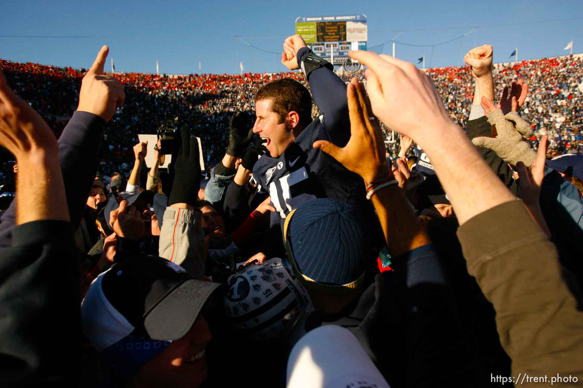 Provo - BYU fans hold Brigham Young quarterback Max Hall (15) on their shoulders, celebrating victory as BYU defeats the University of Utah 17-10 in college football action Saturday at BYU's Lavell Edward Stadium.