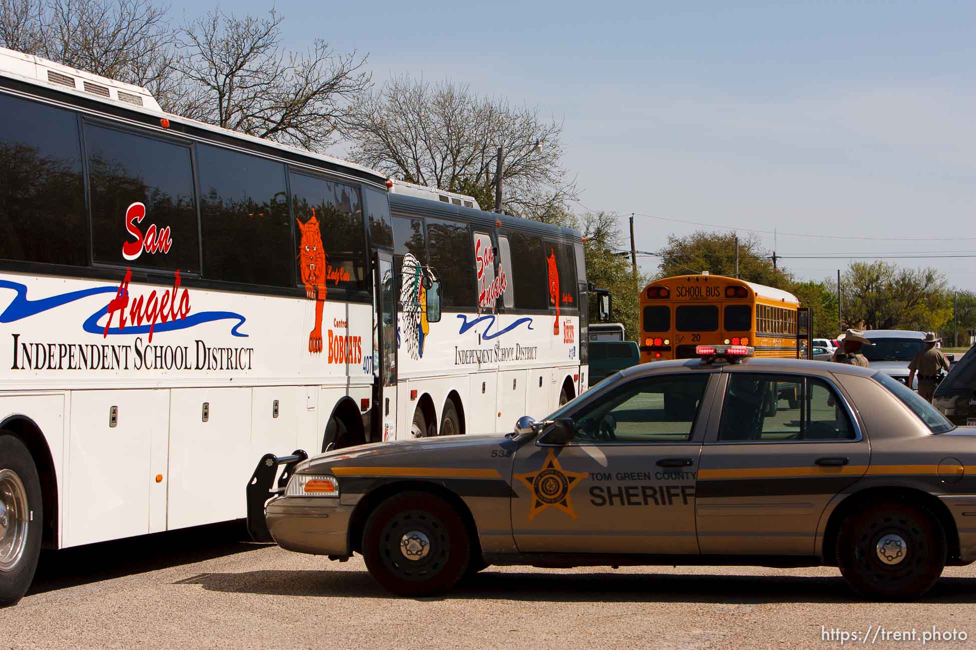 Eldorado - FLDS women and children from the YFZ Ranch are escorted by Texas Child Protective Services workers from the First Baptist Church's Fellowship Hall to waiting buses Sunday, April 6, 2008.