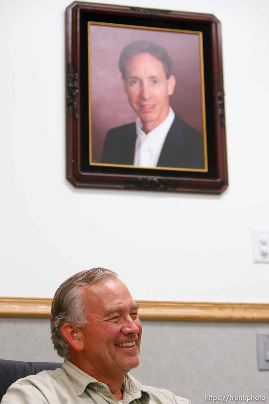 Lamar Johnson in his home on the YFZ Ranch Wednesday, April 16, 2008, talks about his children, taken in the raid. On the wall are portraits of FLDS leaders Warren Jeffs, Wendell Nielsen and Fred Jessop..  Wednesday April 16, 2008.